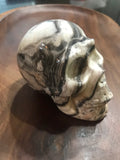 Polished Zebra Onyx Skull Carving – Banded Aragonite / Calcite (1.5 lbs)