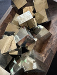 pyrite cubes in a wooden bowl