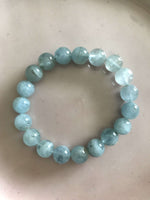 a light blue aquamarine crystal bracelet against a white background