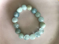 a light blue aquamarine crystal  bracelet on a white background