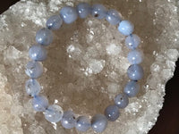 chalcedony crystal bracelet on a white apophyllite crystal