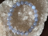chalcedony crystal bracelet on a white apophyllite crystal